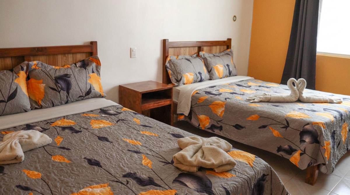 Guest room with two beds at Hotel y Cabañas Alan